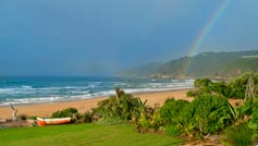 view of ocean and rainbow